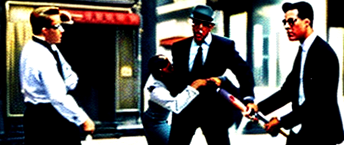 A_vintage_urban_scene_Everybody_wearing_a_business_suit_2_persons_holding_someone_down_while_another_2538238369